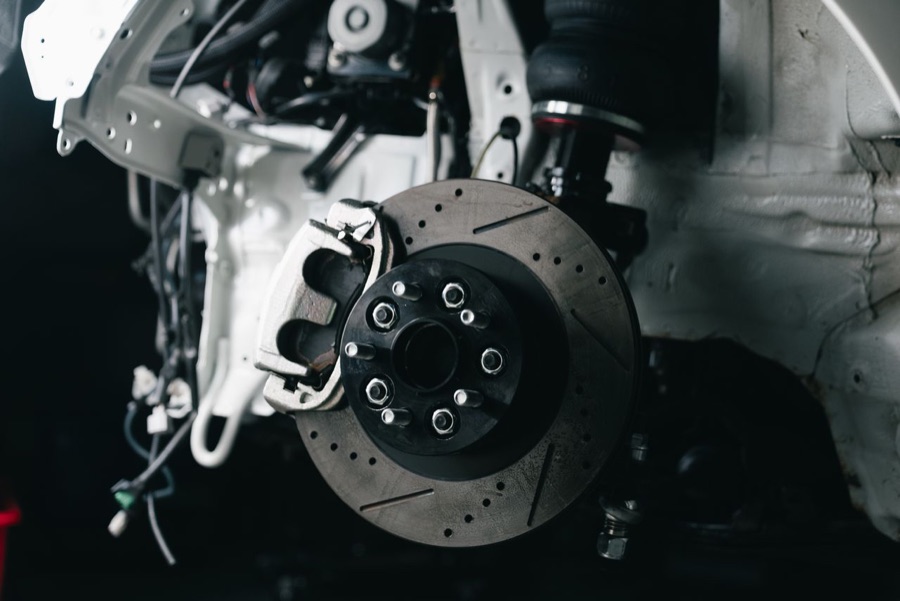 Brake and clutch repairs at ASR – drilled and slotted brake disc with the caliper removed